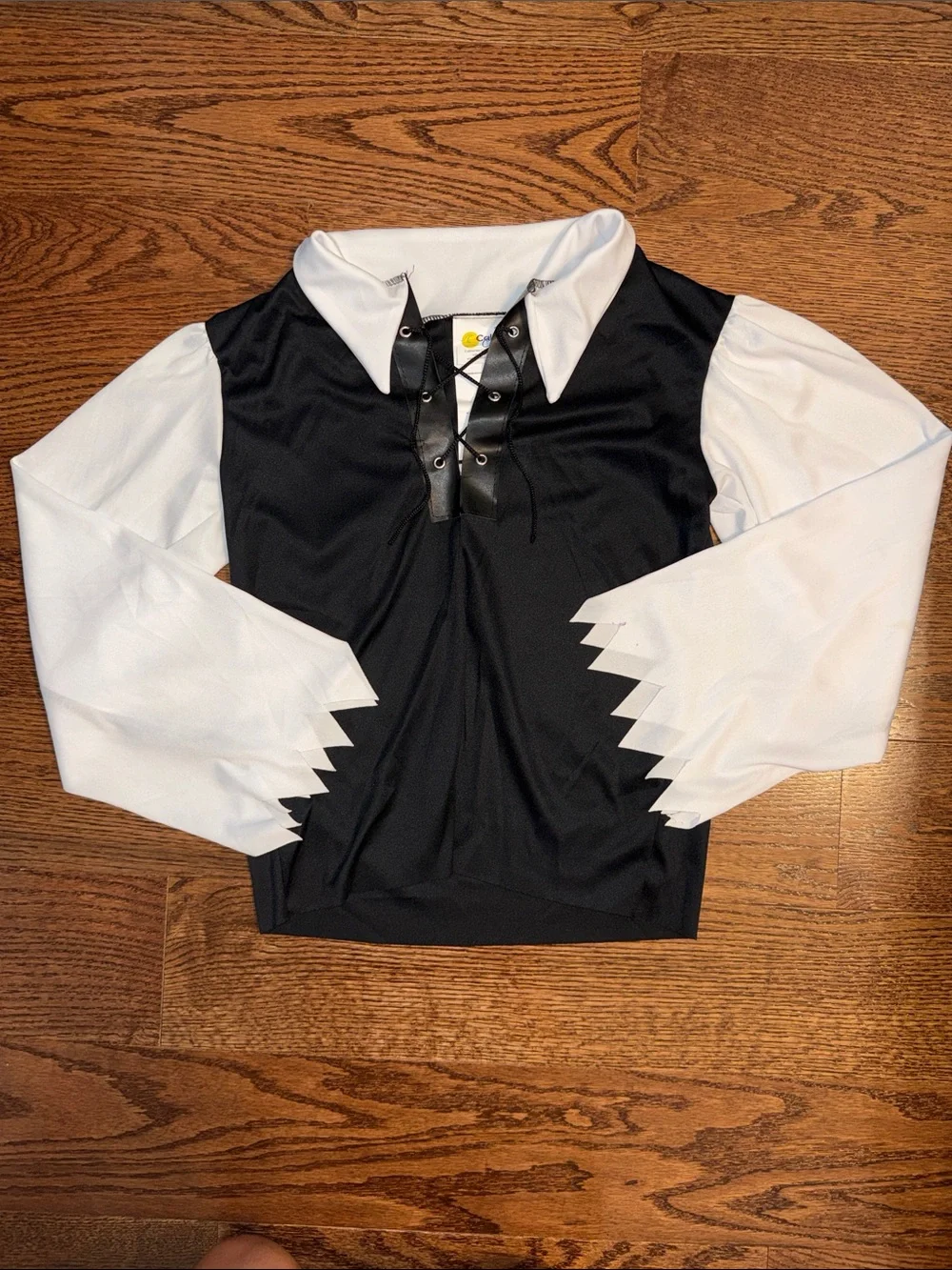 Size s/6-8 pirate costume. Shirt, Pants, Belt, Boot Covers, Scarf, wrist cuffs.